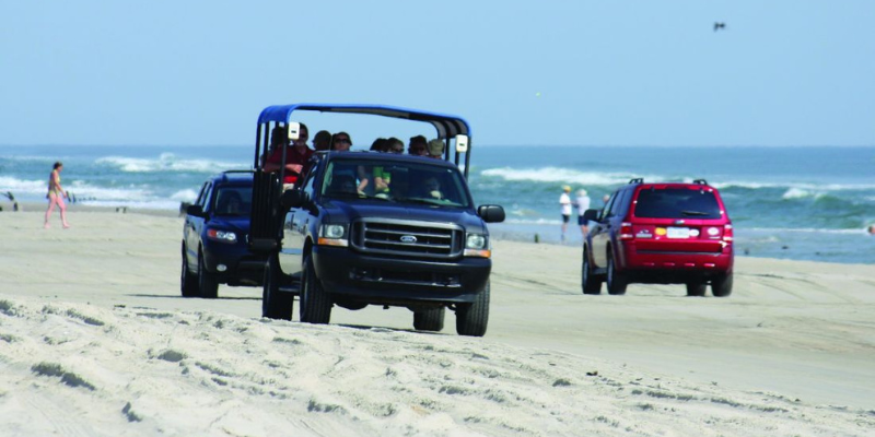 Image of jeep on the sand.