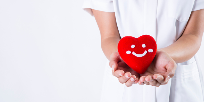 Nurse Holding a Heart